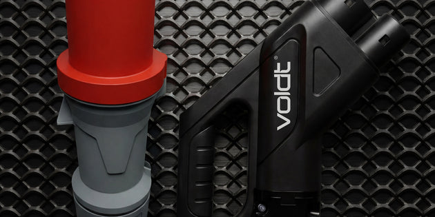 Red CEE industrial plug and CCS2 connector of a portable DC fast charger