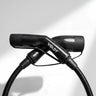 Studio shot of the black carbon fibre Voldt Type 2 EV charging cable and its connectors